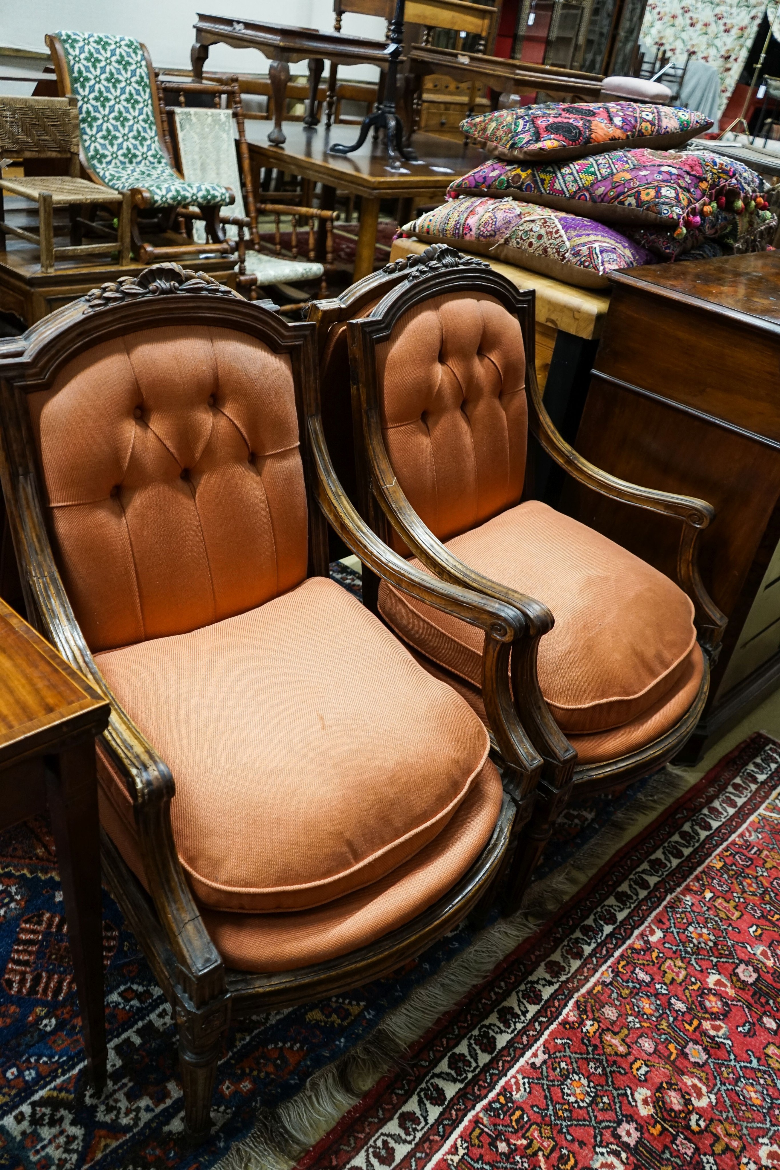 A set of four 19th century French carved walnut elbow chairs with buttoned fabric upholstery, width 65cm, depth 52cm, height 96cm